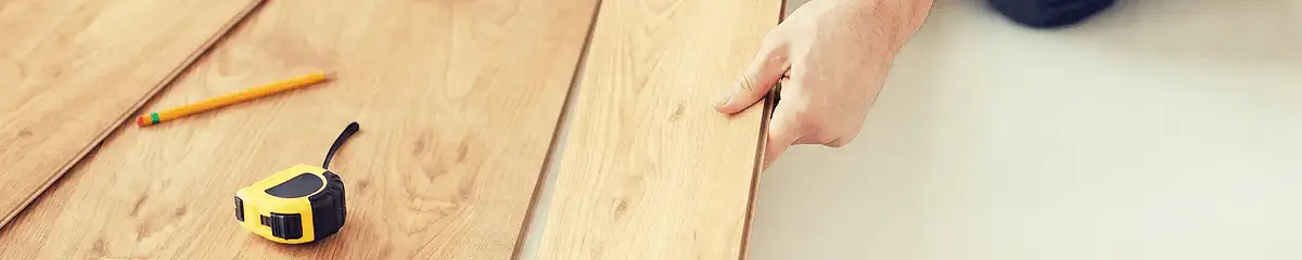 A professional installing wood flooring in Charleston, SC