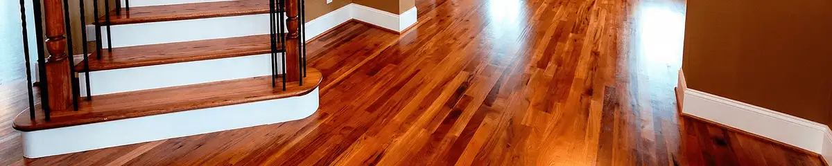 Base floor of a staircase with professionally restored wood flooring in Charleston SC