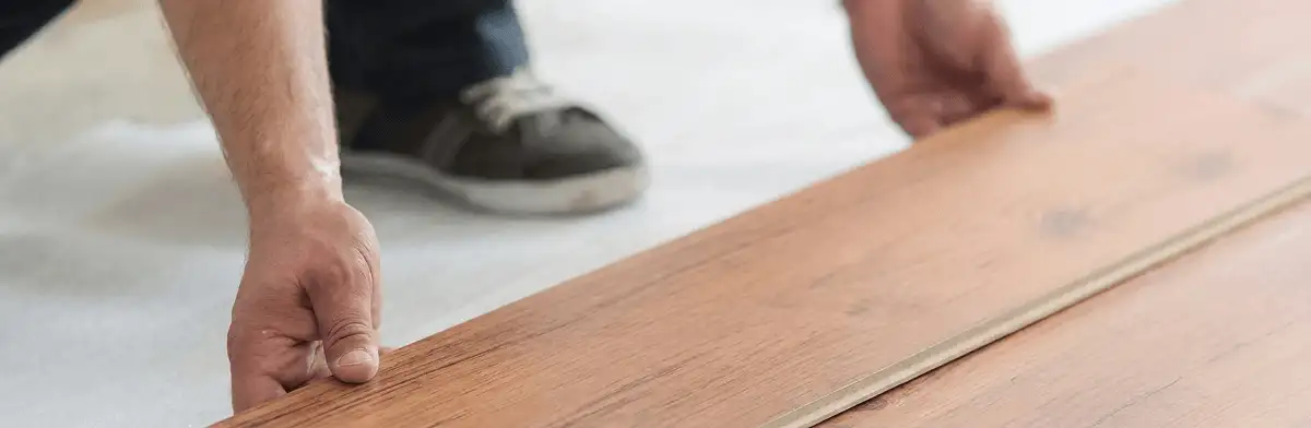 A professional installing laminate flooring in Charleston, SC