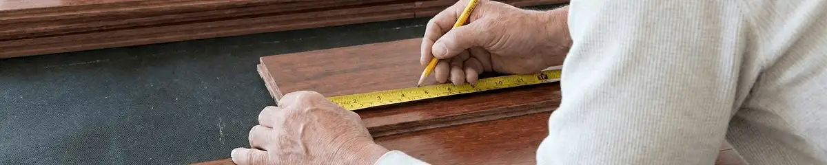 A professional installing wood flooring in Charleston, SC